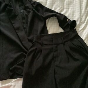 Black blazer and black plaid pants